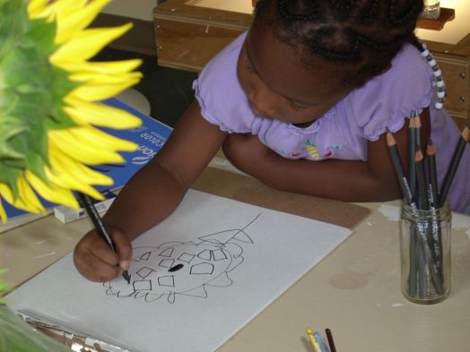Child-Drawing-a-Sunflower